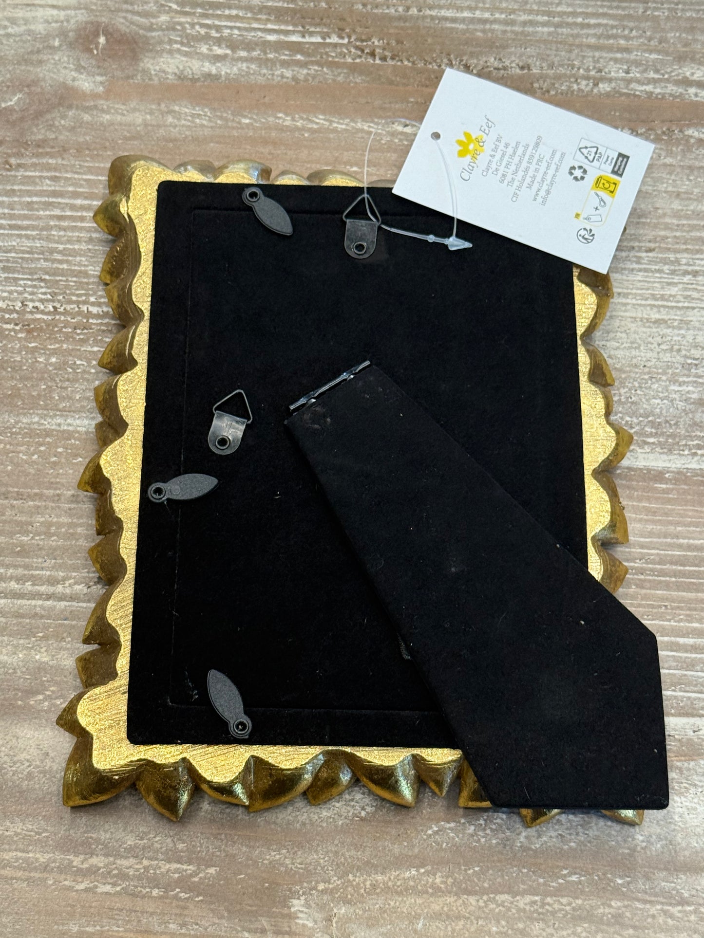 Cornice colo oro a forma di foglie