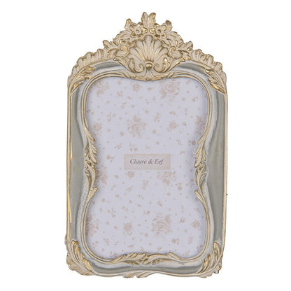 Cornice con decorazione a conchiglia grigia ed oro