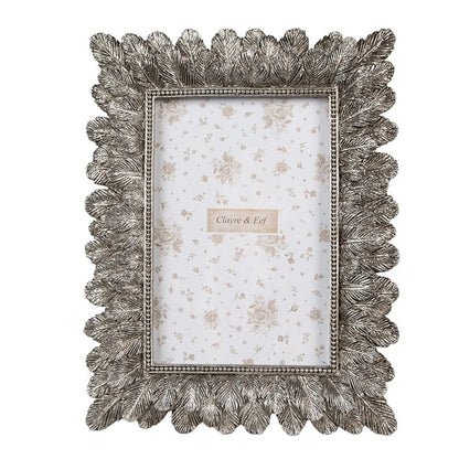 Cornice argento con piume