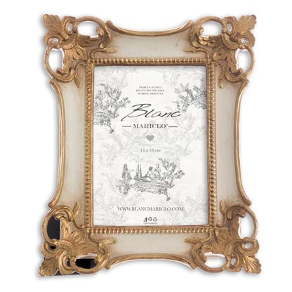Cornice bianca con angoli oro